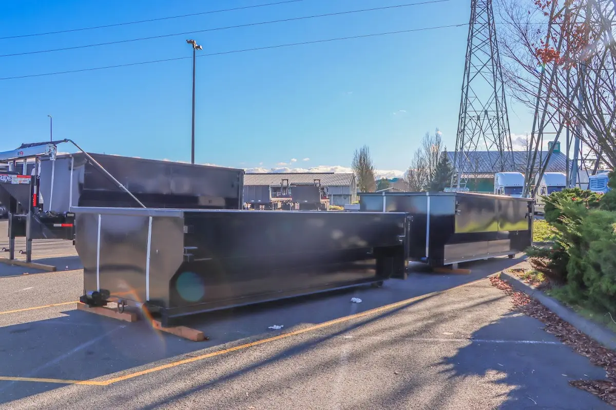 Roll-off dumpster ready for waste disposal at job site for Concrete Dumpster Rental in Vicksburg